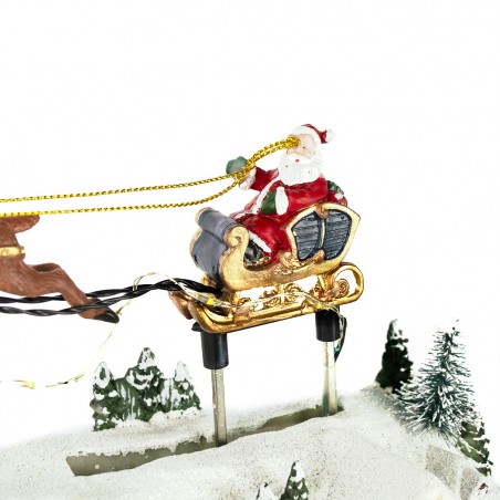 997426 Carrusel navideño con luces, música navideña y movimiento de Papá Noel