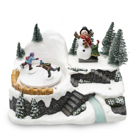 361004 Carrusel pueblo navideño con pista luces y movimiento musical 18x13x16cm