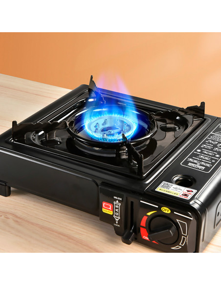 Fogón de gas portátil para camping en maletín, ideal para cocina al aire libre.